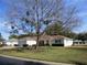 Charming single-story home with well-maintained landscaping and mature tree in front yard at 13779 Sw 115Th Cir, Dunnellon, FL 34432