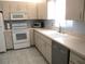 Bright kitchen featuring modern appliances, tile backsplash and bright countertops at 13779 Sw 115Th Cir, Dunnellon, FL 34432