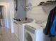 Functional laundry area features a modern washer and dryer, plus storage space for convenience at 13779 Sw 115Th Cir, Dunnellon, FL 34432