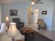 Bright living room with tile floors, lots of natural light and views to kitchen at 13779 Sw 115Th Cir, Dunnellon, FL 34432