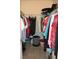 Walk-in closet with shelving and rods for optimal storage of clothes and accessories at 13779 Sw 115Th Cir, Dunnellon, FL 34432