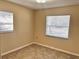 This bright bedroom features tiled floors, neutral walls, and plenty of natural light from the window at 1904 Ne 50Th St, Ocala, FL 34479