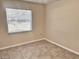 Bedroom with tiled floor, a large window, and neutral paint is ready for its new residents at 1904 Ne 50Th St, Ocala, FL 34479