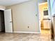 Bedroom with neutral paint, tile floors and attached bathroom at 1904 Ne 50Th St, Ocala, FL 34479