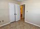 Bedroom offers closet and entry doors and tile flooring at 1904 Ne 50Th St, Ocala, FL 34479