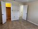 Bedroom with tiled floor, two windows with window coverings, and neutral paint is ready for its new residents at 1904 Ne 50Th St, Ocala, FL 34479
