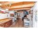 Versatile bonus room with wood floors, ample storage, and workspace, ideal for hobbies or a home office at 19390 Se 95Th Pl, Ocklawaha, FL 32179