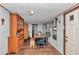 Bright dining room featuring a wooden table, bench seating, and built-in hutch at 19390 Se 95Th Pl, Ocklawaha, FL 32179
