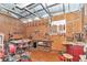 Workshop includes a pegboard, tools, tables and vinyl flooring at 19390 Se 95Th Pl, Ocklawaha, FL 32179