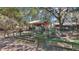 Exterior of property showing the charming backyard with a fenced-in garden area at 19390 Se 95Th Pl, Ocklawaha, FL 32179