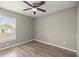 Bedroom featuring wood-look floors, ceiling fan, and neutral paint at 2 Hemlock Terrace Trl, Ocala, FL 34472