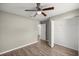 Bedroom with closet, ceiling fan, wood-look floors, and neutral paint at 2 Hemlock Terrace Trl, Ocala, FL 34472