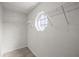 Walk-in closet featuring an octagonal window and wire shelving for storage at 2 Hemlock Terrace Trl, Ocala, FL 34472
