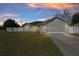 Charming home featuring attached two car garage, manicured lawn and landscaping at 2 Hemlock Terrace Trl, Ocala, FL 34472