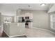 Eat-in kitchen featuring stainless steel appliances, light colored cabinets, and modern countertops at 2 Hemlock Terrace Trl, Ocala, FL 34472
