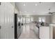Modern kitchen featuring stainless steel appliances, granite countertops, and a breakfast bar at 2 Hemlock Terrace Trl, Ocala, FL 34472