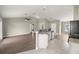 Open living room featuring an eat-in kitchen, stainless steel appliances and wood flooring at 2 Hemlock Terrace Trl, Ocala, FL 34472