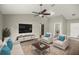 Bright living room with stylish furniture, ceiling fan, and modern decor, creating a comfortable space at 2 Hemlock Terrace Trl, Ocala, FL 34472