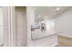 Modern kitchen featuring a granite countertop island, stainless steel appliances, and a practical pantry at 24237 Sw South Lakes Ct, Dunnellon, FL 34431