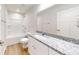 Clean, functional bathroom features granite vanity, and shower-tub combination at 24264 Sw South Hills Ct, Dunnellon, FL 34431
