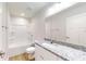 Bathroom featuring granite countertops and a shower over tub at 24264 Sw South Hills Ct, Dunnellon, FL 34431