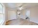 This bedroom includes wood-look floors, a ceiling fan and a double-door closet at 24264 Sw South Hills Ct, Dunnellon, FL 34431