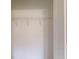 Spacious closet featuring a single shelf and clothing rod, with white doors at 24264 Sw South Hills Ct, Dunnellon, FL 34431