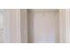 Bright and airy closet featuring a single shelf and clothing rod, with white doors at 24264 Sw South Hills Ct, Dunnellon, FL 34431