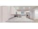 Modern kitchen featuring white cabinetry, stainless steel appliances, and granite countertops at 24264 Sw South Hills Ct, Dunnellon, FL 34431