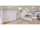 Open-concept living room featuring modern lighting, hard surface flooring, and a view to kitchen at 24264 Sw South Hills Ct, Dunnellon, FL 34431