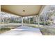 Covered outdoor patio perfect for relaxing and enjoying the beautiful backyard views at 24264 Sw South Hills Ct, Dunnellon, FL 34431