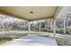 Covered outdoor patio space perfect for enjoying the natural views and outdoor relaxation at 24264 Sw South Hills Ct, Dunnellon, FL 34431