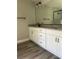 Stylish bathroom featuring double vanity with granite countertops and modern fixtures at 4721 Nw 67Th St, Ocala, FL 34482