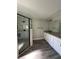 Modern bathroom features a glass enclosed shower, dual vanity, and granite countertops at 4721 Nw 67Th St, Ocala, FL 34482