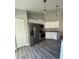 Modern kitchen boasts stainless steel appliances, granite countertops, and ample cabinet space at 4721 Nw 67Th St, Ocala, FL 34482