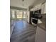 Bright kitchen features stainless steel appliances, granite countertops, and ample cabinet space at 4721 Nw 67Th St, Ocala, FL 34482