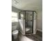 Modern shower featuring tile surround, glass enclosure, and a rain shower head at 4721 Nw 67Th St, Ocala, FL 34482