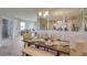 Stylish dining area with seating, connecting to the kitchen and living room, promoting an open-concept design at 4766 Nw 39Th Street Rd, Ocala, FL 34482