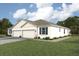 A charming one-story home featuring a paver driveway, a two-car garage and manicured landscaping at 4766 Nw 39Th Street Rd, Ocala, FL 34482