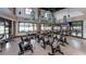 Bright, spacious gym featuring rows of stationary bikes, mirrors, and views of the water at 4766 Nw 39Th Street Rd, Ocala, FL 34482