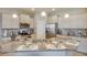 Bright kitchen with granite countertops, stainless steel appliances, and a functional island at 4766 Nw 39Th Street Rd, Ocala, FL 34482