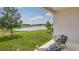 Relaxing outdoor patio area with comfortable seating overlooking a scenic pond and fountain at 4766 Nw 39Th Street Rd, Ocala, FL 34482