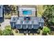 Aerial view of house with solar panels on the roof and a large screened in pool area at 4940 E Fort King St, Ocala, FL 34470