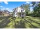 Spacious, shady backyard with a screened porch, ideal for outdoor living at 4940 E Fort King St, Ocala, FL 34470