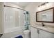 Updated bathroom featuring a tub, shower combo, and granite vanity at 4940 E Fort King St, Ocala, FL 34470