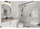 Modern bathroom featuring a glass shower, granite counters, and stylish fixtures at 4940 E Fort King St, Ocala, FL 34470