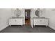 Bathroom with granite countertop vanity, double sinks, and tile floors at 4940 E Fort King St, Ocala, FL 34470