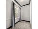 Empty carpeted bedroom featuring a large window and custom curtains at 4940 E Fort King St, Ocala, FL 34470