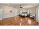 Bright bedroom with wood floors, big windows, and a stylish bedframe at 4940 E Fort King St, Ocala, FL 34470