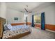 This bedroom features two windows and a plush bed with ocean-themed decor at 4940 E Fort King St, Ocala, FL 34470